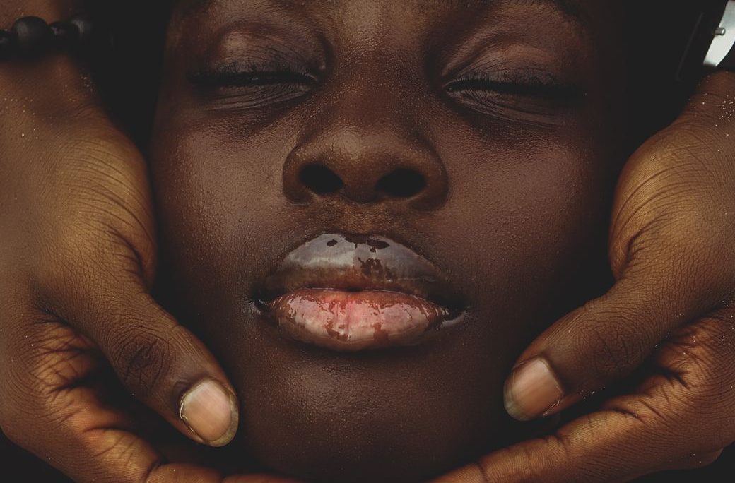 a woman with her eyes closed